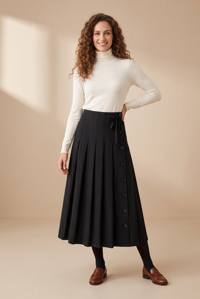 Black pleated maxi skirt with button detail and bow tie at waist