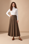 Brown pleated maxi skirt with D-ring belt at waistband