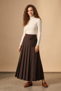 Dark brown pleated maxi skirt with button placket and side bow tie