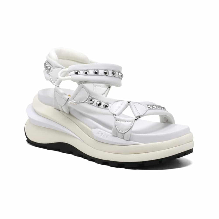 White leather platform sandals with studded straps and ankle wrap.