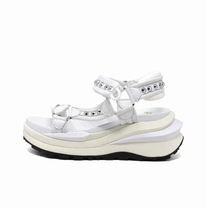 White leather platform sandals with crisscross straps and studded trim.