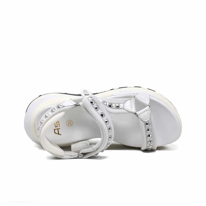 White leather platform sandals, side view with studded toe strap.