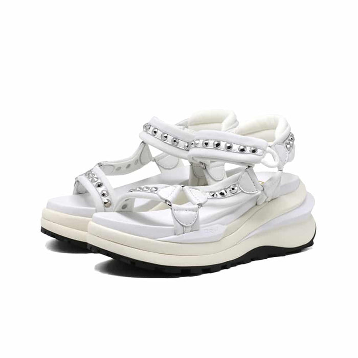 White leather platform sandals, front view with buckled ankle strap.