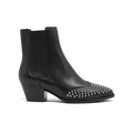 Black leather ankle boots with elastic side panels and chunky heel; studded toe cap.