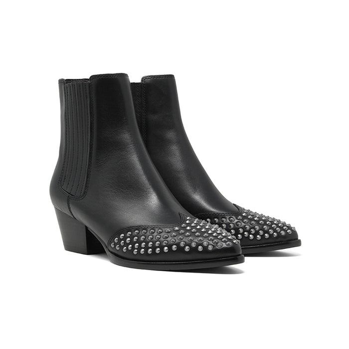 Pair of black leather ankle boots with elastic side panels and studded toe along chunky heels.
