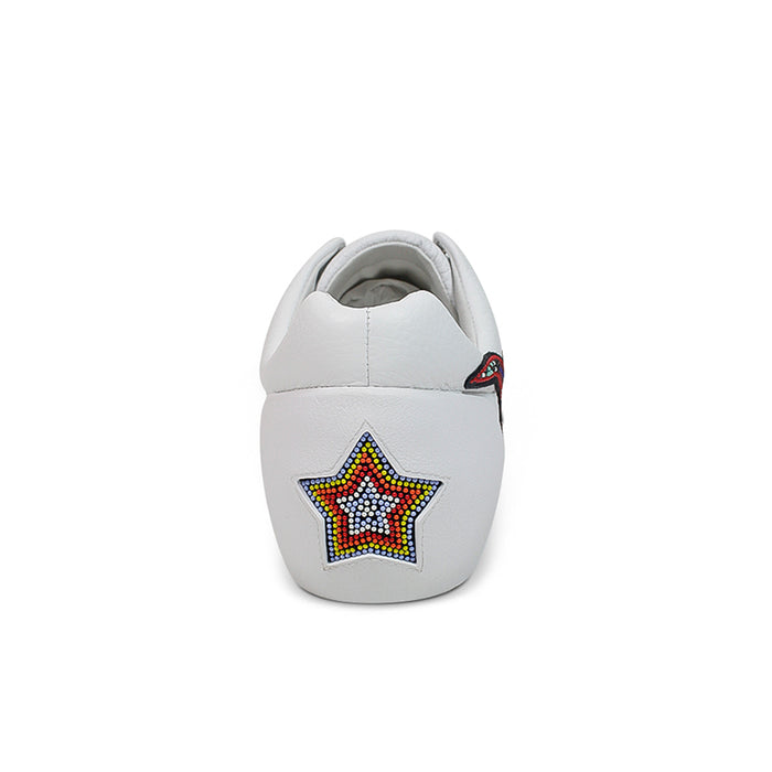 Women’s white leather sneakers heel tab with multicolor star emblem and gray lining