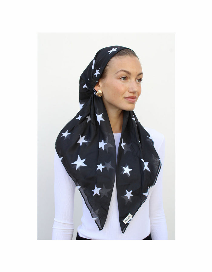 Pre-tied headscarf with black base and white star pattern, draped around head