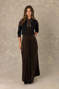 Leopard print velvet maxi dress with tie bow and matching black knit cardigan.