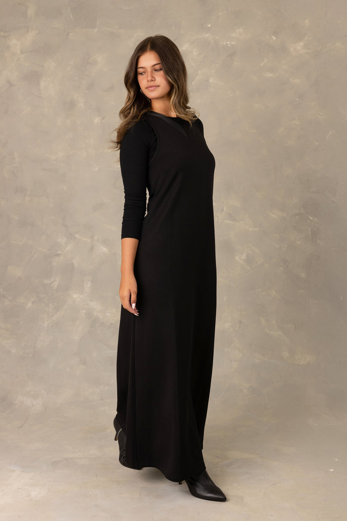 Black jersey sleeveless maxi dress with  tonal trimmed v-neckline.