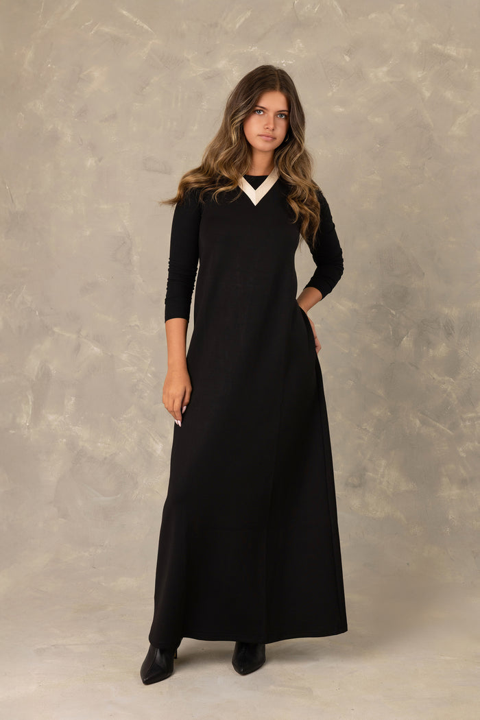 Black jersey sleeveless maxi dress with contrast trimmed v-neckline.