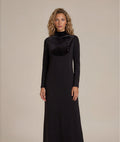 Black long sleeve jersey maxi dress with rhinestone studded velvet bib and mock turtleneck collar.