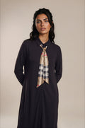 Black long sleeve button down maxi dress with collar and plaid neck tie sash.