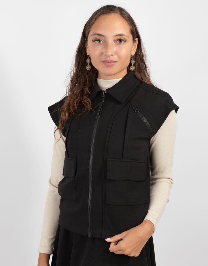 Black utility zip vest with zip-up front, patch chest pocket, and side pockets