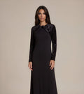 Black velvet maxi dress with bow detail at neckline, long sleeves, fitted silhouette