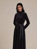 Black long sleeve velour maxi dress with ribbon sash and mock turtleneck collar.
