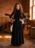 Kids' sleeveless black velvet maxi dress with crossover bodice and ruffled waist.