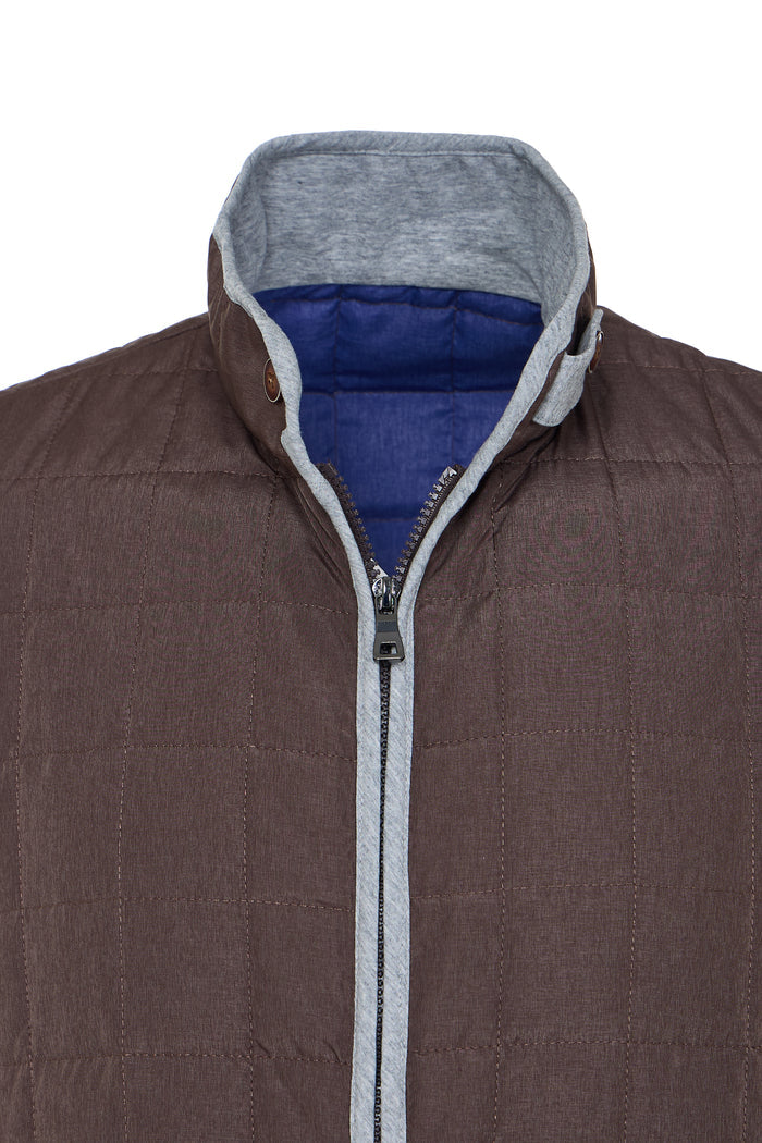 Brown jacket with gray hood and blue lining on a white background