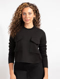 Cropped black long-sleeve top with two chest flap pockets