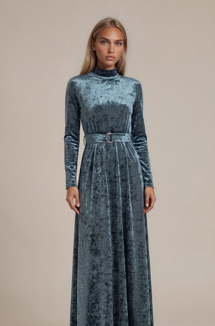 Grey crushed velvet long sleeve maxi dress with mock turtle neck collar and metal loop self belt.