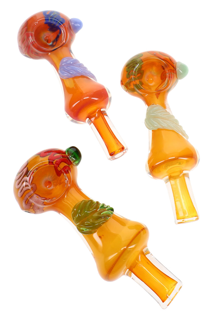 Assorted 5″ gold fumed glass spoon pipes with leaf accents, squiggle striped bowls, and marbles