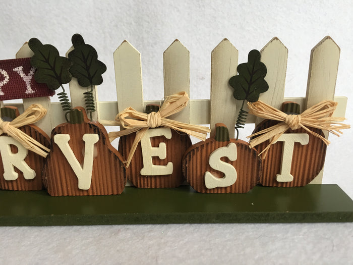 Harvest Pumpkins Against Picket Fence Block Sitter
