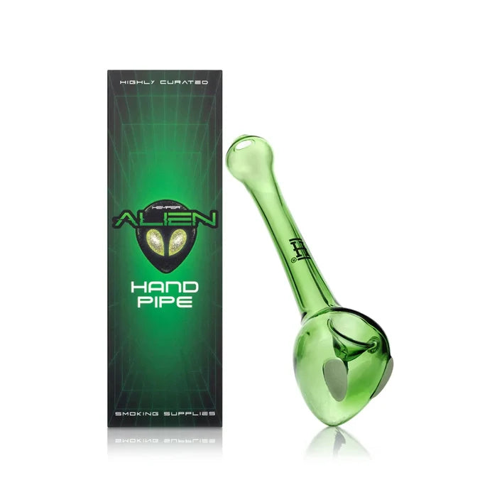 Hemper alien glass hand pipe beside green sci-fi retail box with alien head logo and hand pipe text