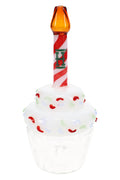Cupcake-shaped glass hand pipe with white sprinkle top, clear base, and red swirl candle stem