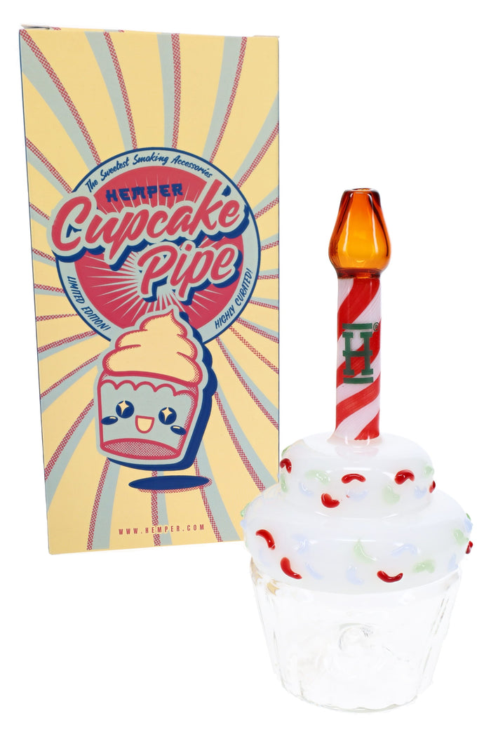 HEMPER Cupcake glass hand pipe beside retail box with sprinkle frosting and candle mouthpiece