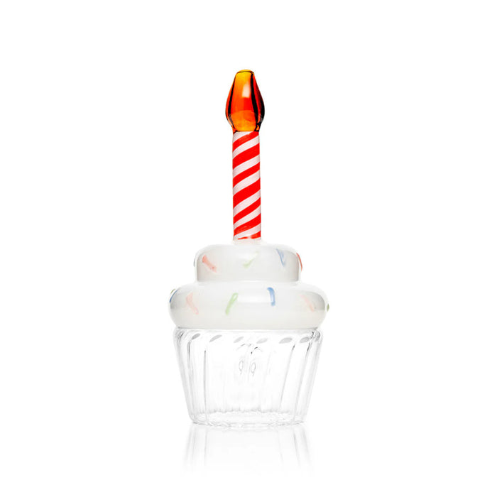 Back view of cupcake glass hand pipe with clear ridged base, white frosting, and flame mouthpiece