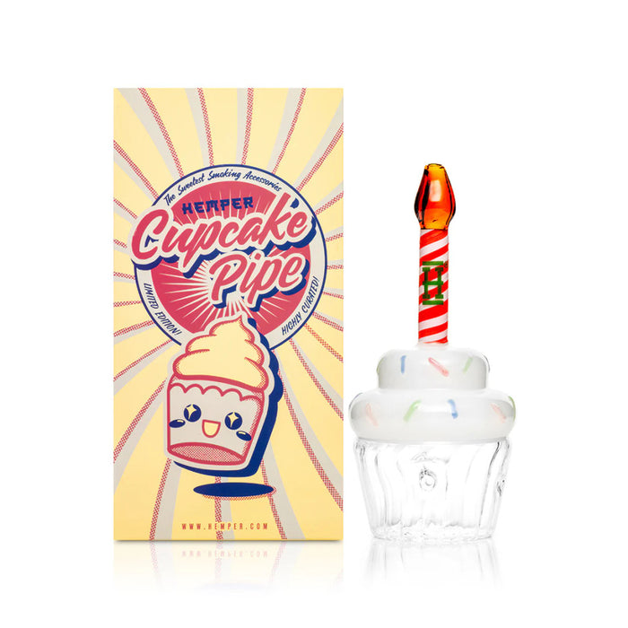 HEMPER Cupcake glass hand pipe beside retail box with sprinkle frosting and candle mouthpiece
