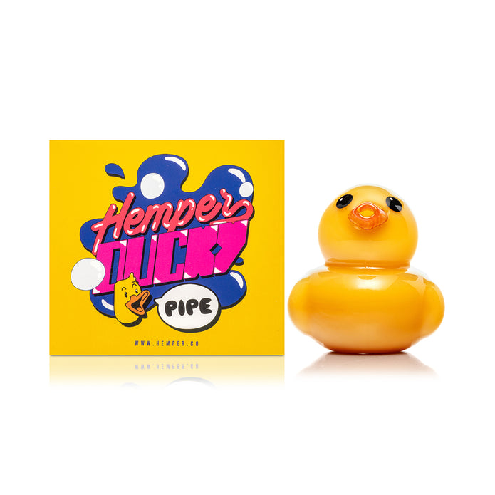 Side profile of Hemper Ducky glass hand pipe highlighting rounded body, orange beak detail, and palm-friendly grip