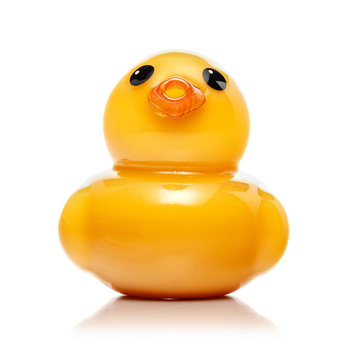Close-up of Hemper Ducky pipe showing yellow duck body, printed HEMPER logo, and clean sculpted glass details