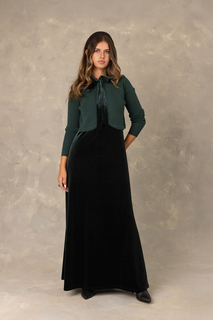 Hunter green velvet maxi dress with neck  tie bow and knit cardigan.