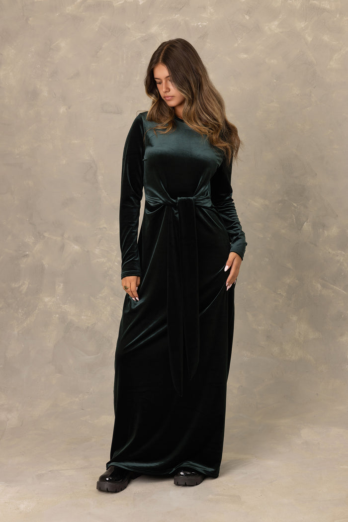 Hunter green velvet long sleeve maxi dress with front knot detail.