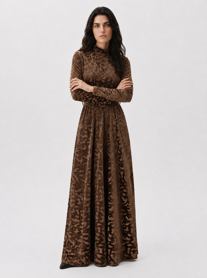 Light brown patterned velvet long sleeve maxi dress with mock turtle neck collar and metal loop self belt.