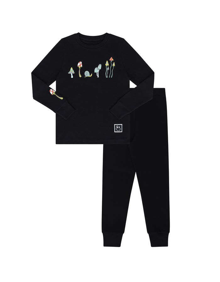 Kids black long-sleeve pajama set with colorful mushroom graphic and matching pants