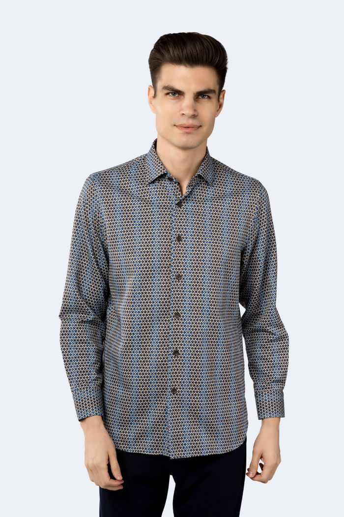 Man wearing a patterned shirt on a white background