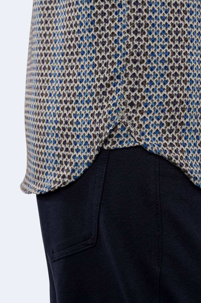 Close-up of a patterned shirt with a plain background