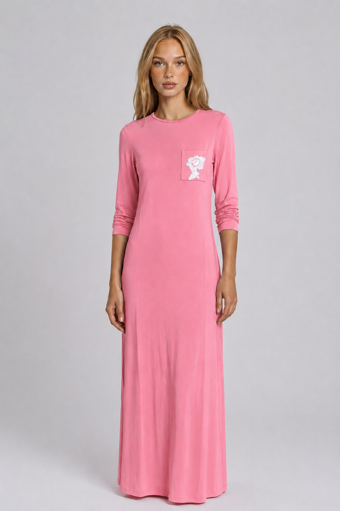 Pull on pink nightgown with pocket and embroidered floral motif.