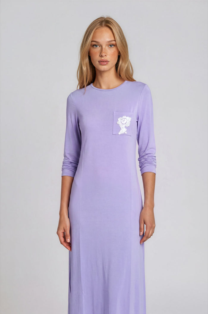 Pull on lilac nightgown with pocket and embroidered floral motif.