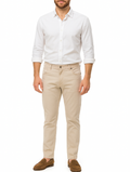 Man wearing a white shirt and beige pants on a white background