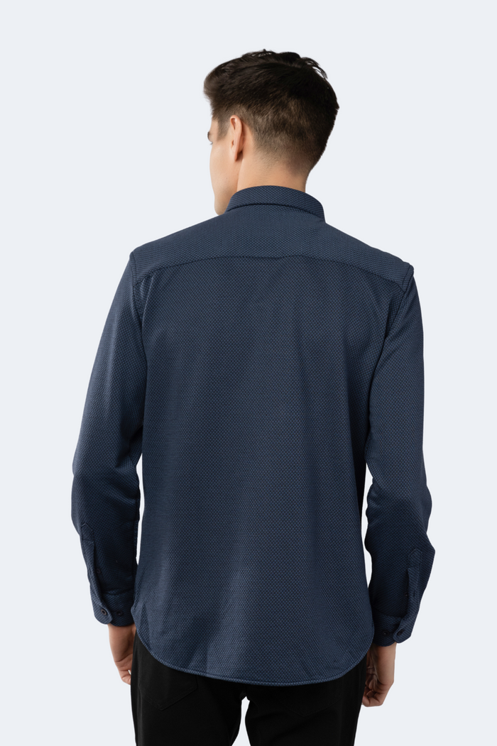 Man wearing a navy blue shirt on a white background