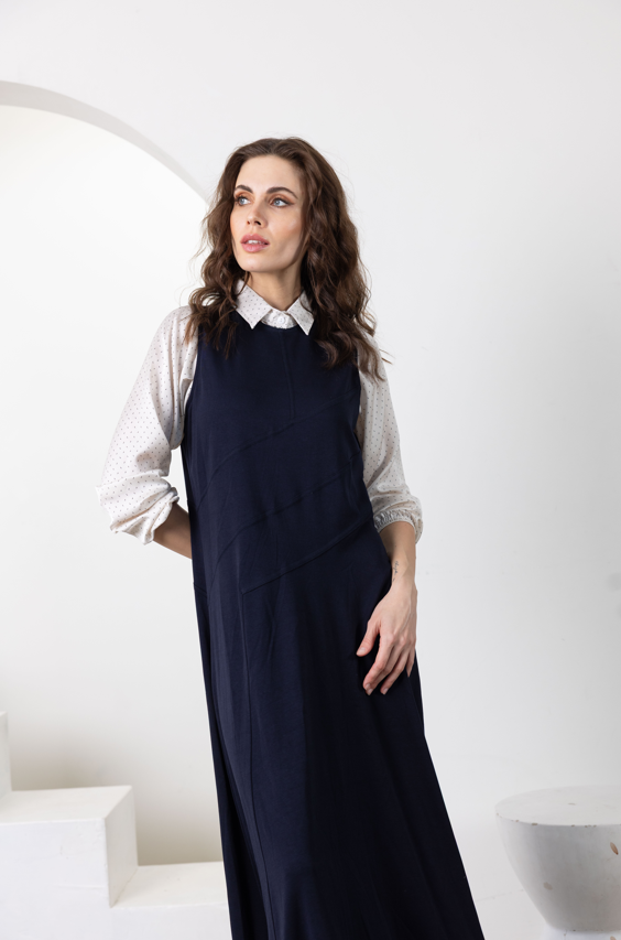 Navy sleeveless long jumper with diagonal seam detail and straight skirt front