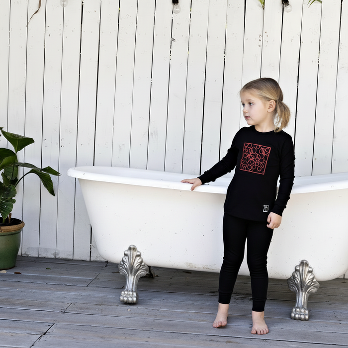 Boys' black pajama set with red doodle graphic front and matching slim pants
