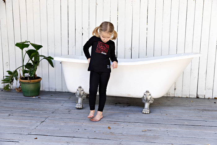 Boys' black long-sleeve pajama set with red doodle graphic front and matching pants