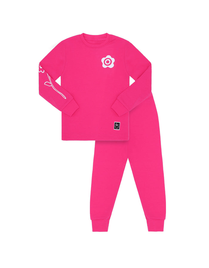 Pink kids pajama legging set with long-sleeve top, leggings, and flower chest patch.