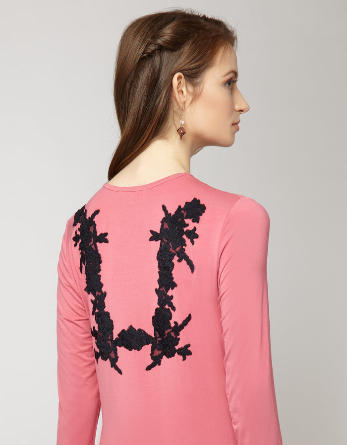 Pink pull-on nightgown with black lace appliqué on back and long sleeves