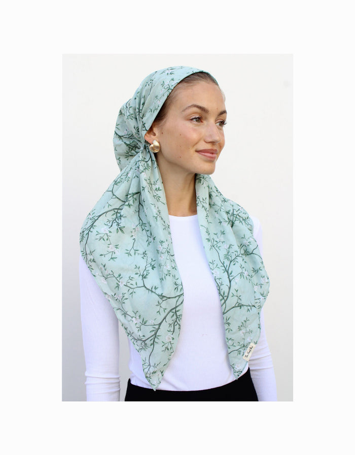Sage-green pre-tied headscarf with delicate vine pattern and velvet grip