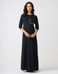 Black satin-trim nightgown with long sleeves and gold pocket