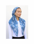 Slate blue patterned pre-tied headscarf with white branch print, draped over head and neck